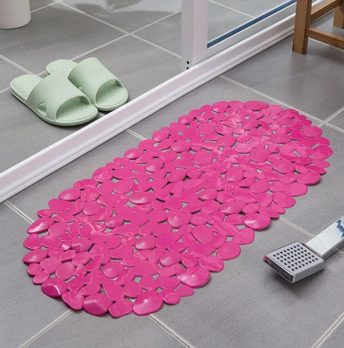 Blue fast-drying mat on a bathroom floor